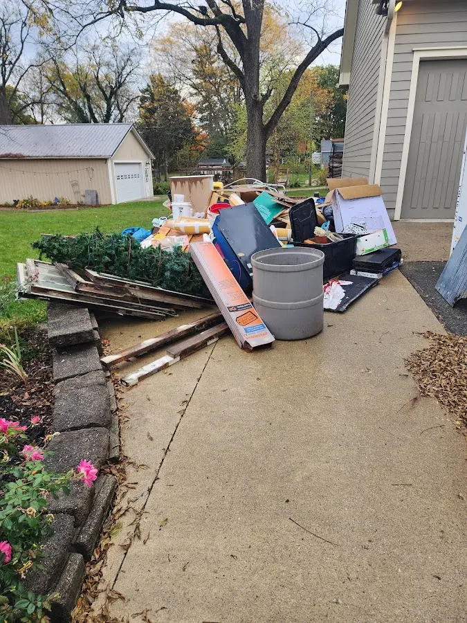 Dumpster being loaded with debris for 10 Yard Dumpster Rental in Viera West